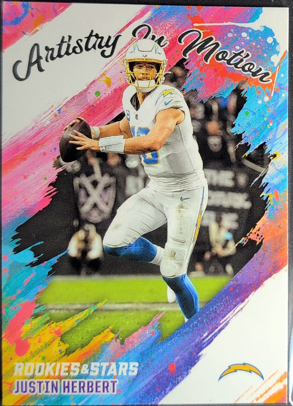 2025 Panini Rookies & Stars Justin Herbert #11 Artistry in Motion Los Angeles Chargers front